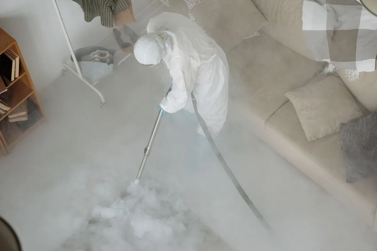Biohazard cleanup technician in protective equipment, Minden, LA